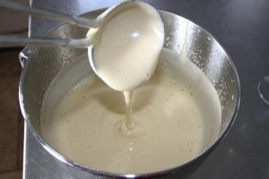 The passionfruit mixture becomes a light creamy yellow and very frothy with lots of minute air bubbles.